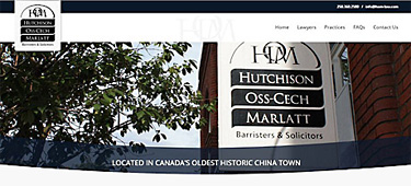 Hutchison Oss-Cech Marlett - sign hanging outside their building in Victoria's Chinatown on corner of Fisgard St. & Store
