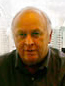 Frank Bailey, LLB 40 years experience as a business lawyer and civil litigator, sitting in his office overlooking Metrotown skytrain station, in Burnaby
