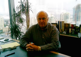 Commercial-Business-Employment-Disputes lawyer Frank Baily with view of Burnaby fr. Metrotown Tower 20th floor office in background